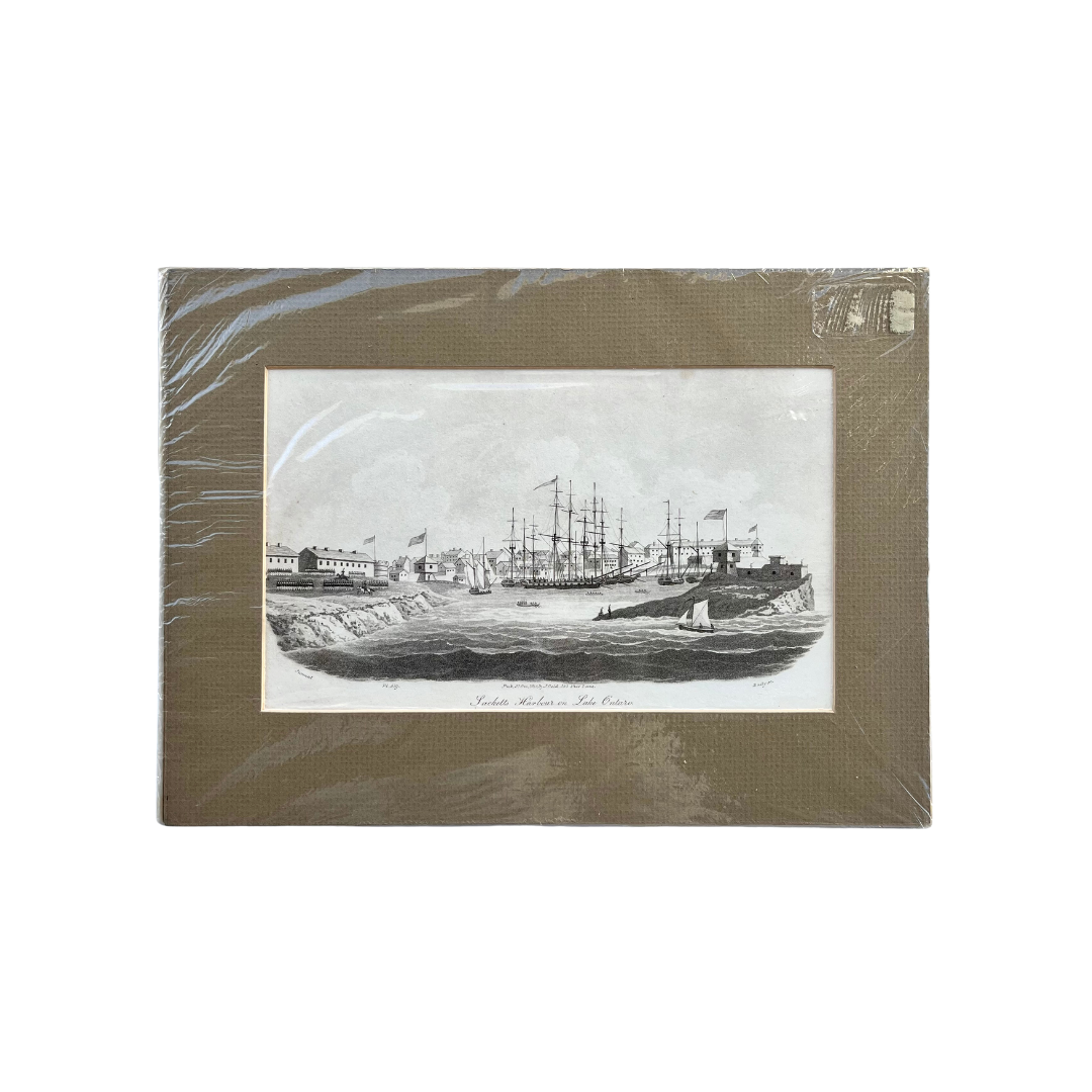 Black and white matted print of Sackett’s Harbour on Lake Ontario with ships and soldiers, American flags, troops and more, for sale by Victoria Cooper Antique Prints